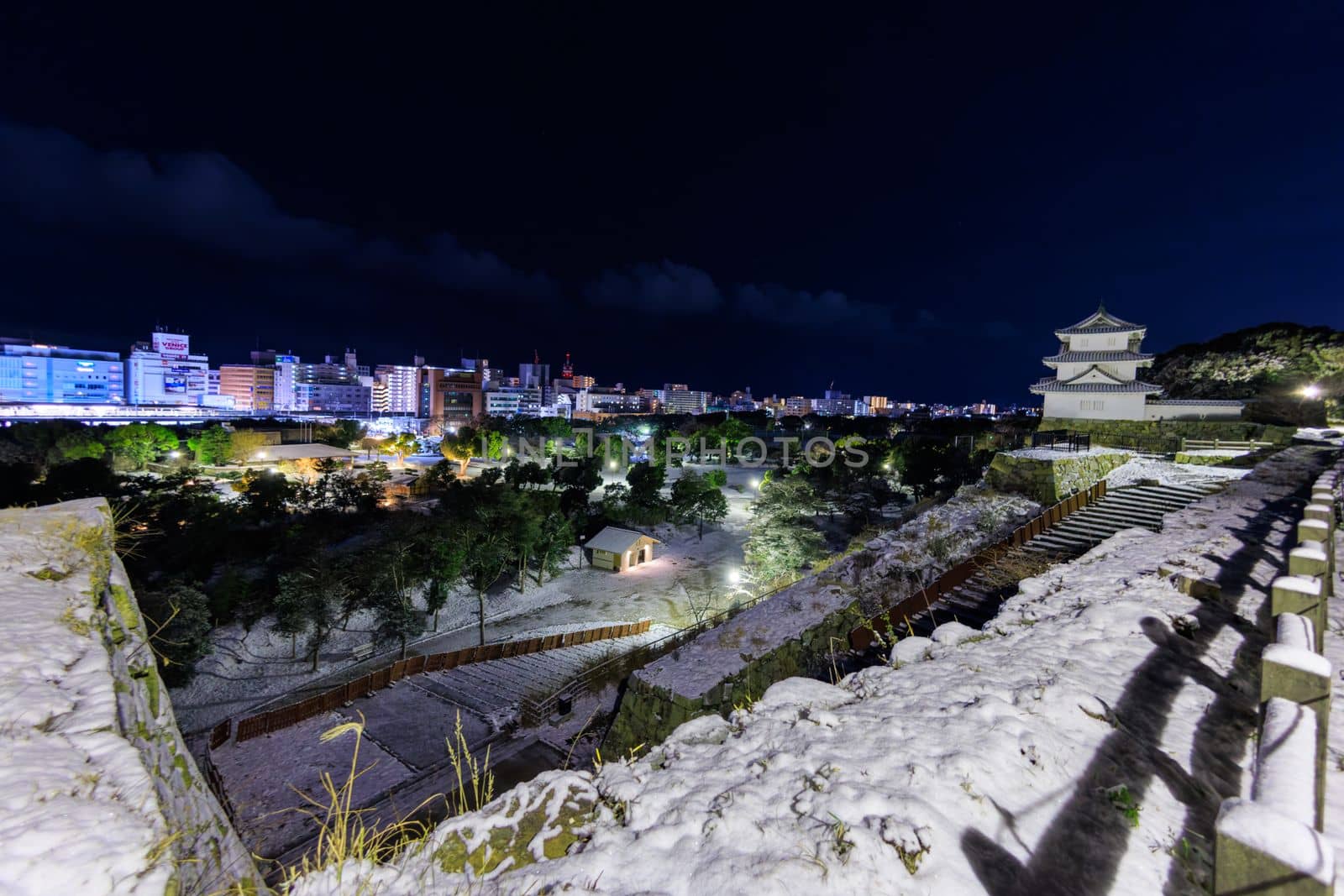 Akashi Castle and city skyline on snowy winter night by Osaze