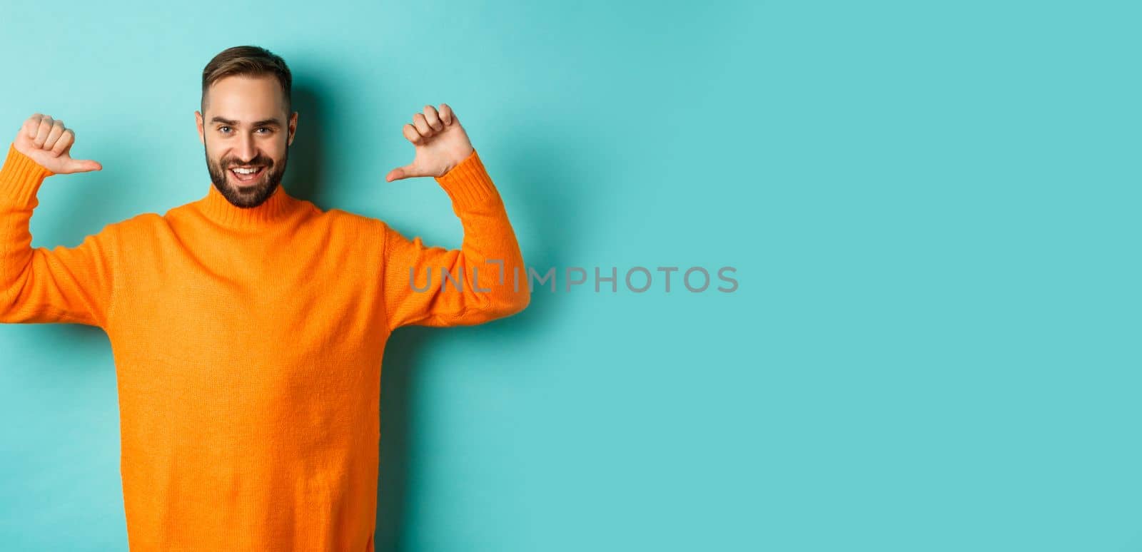 Handsome confident man pointing at himself, looking self-assured, standing in orange sweater against light blue background by Benzoix