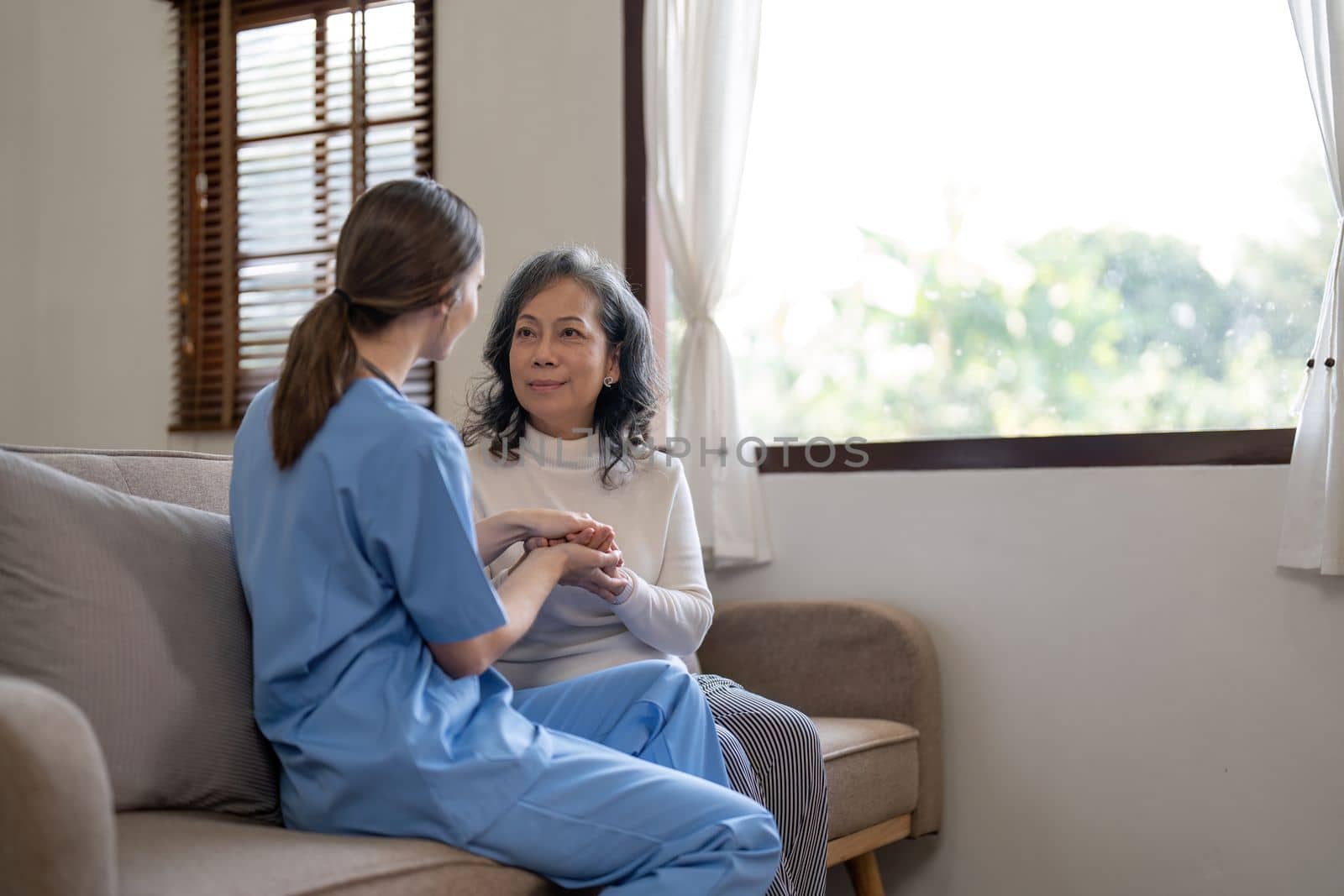 Nurse, hands and senior patient in empathy, safety and support of help, trust and healthcare consulting. Nursing home, counseling and gratitude for medical caregiver, client and hope in consultation.