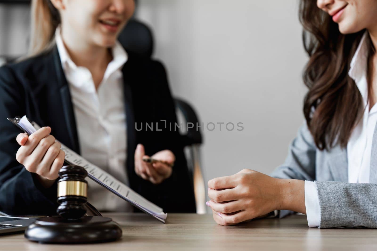 Close up of business person and lawyers discussing agreement contract in office. Law, legal services, advice, Justice concept.