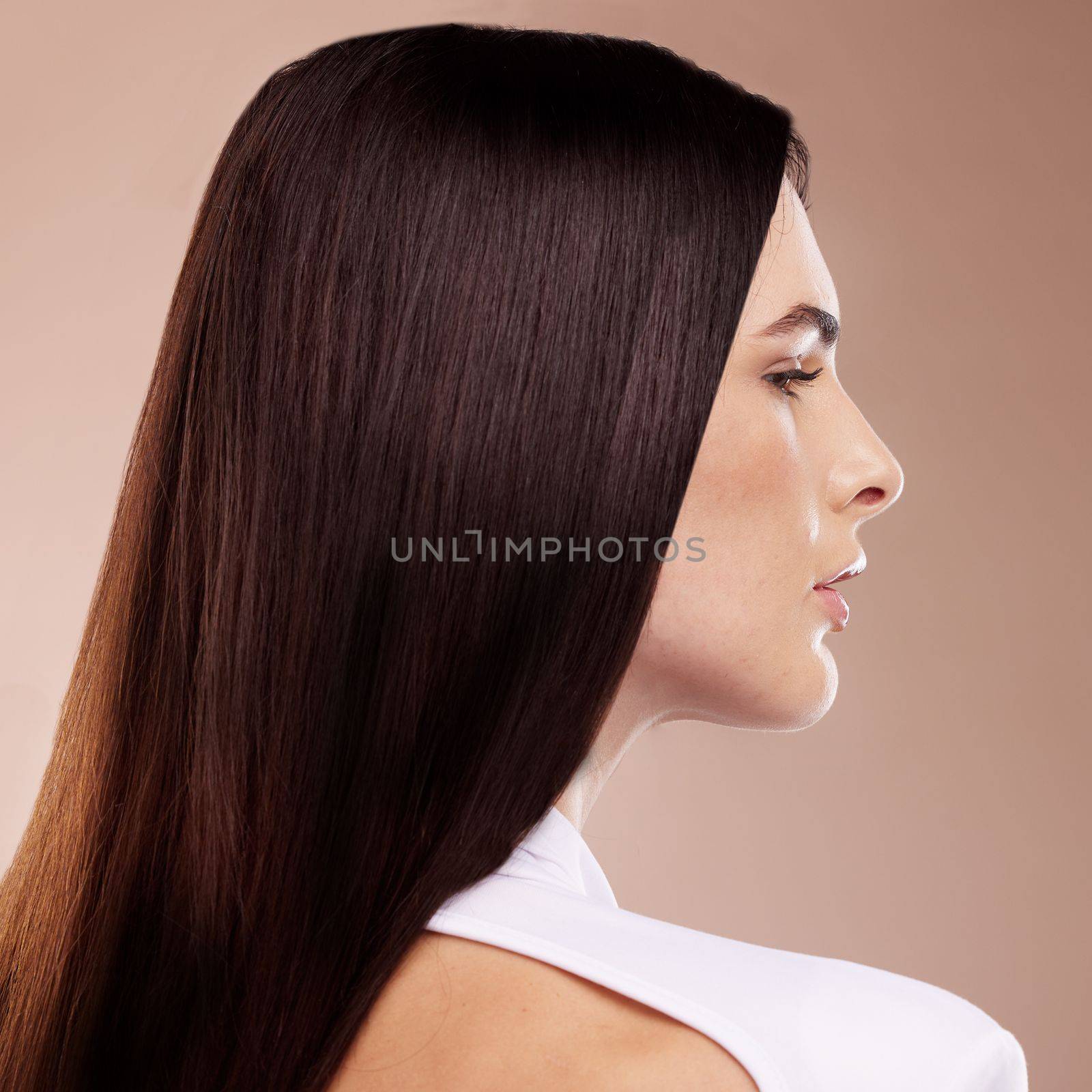 Face profile, beauty and hair care of woman in studio isolated on a brown background. Balayage, hairstyle and young female model with healthy, beautiful and long hair after salon treatment for growth.