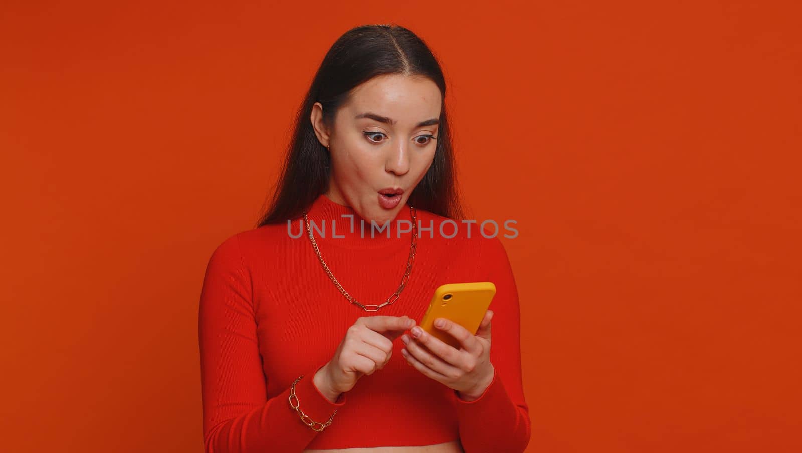 Happy excited joyful woman use smartphone typing browsing shouting say wow yes found out great big win, good news, lottery jackpot goal achievemen, game victory, celebrating success, winning, like
