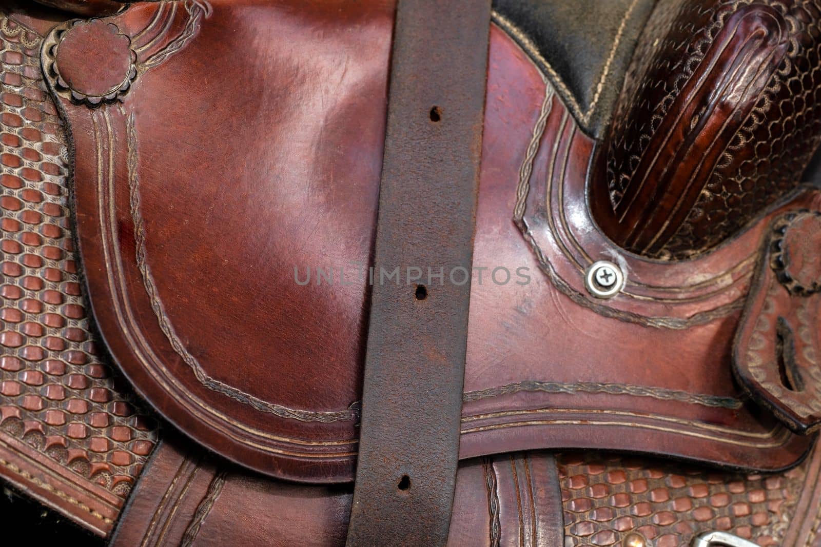 Leather horse saddle design close up background texture. Brown cowboy design by Annebel146