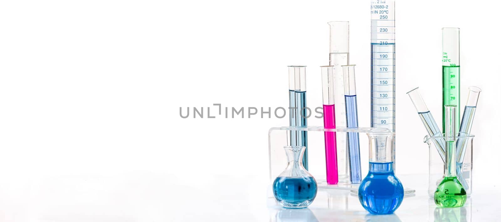 Various laboratory flasks with a colored reagents, pipette by JPC-PROD