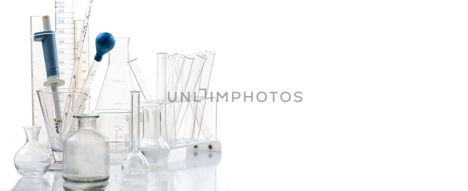 Group of scientific laboratory glassware with clear liquid solution, Science research and development concept.