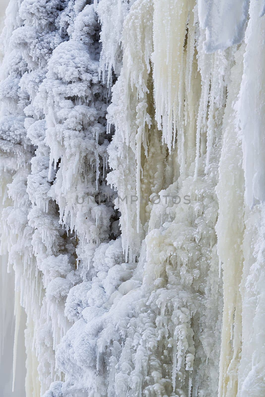 Frozen small mountain waterfall close up. Frozen Jagala Falls, Estonia. small river waterfall frozen in winter.
