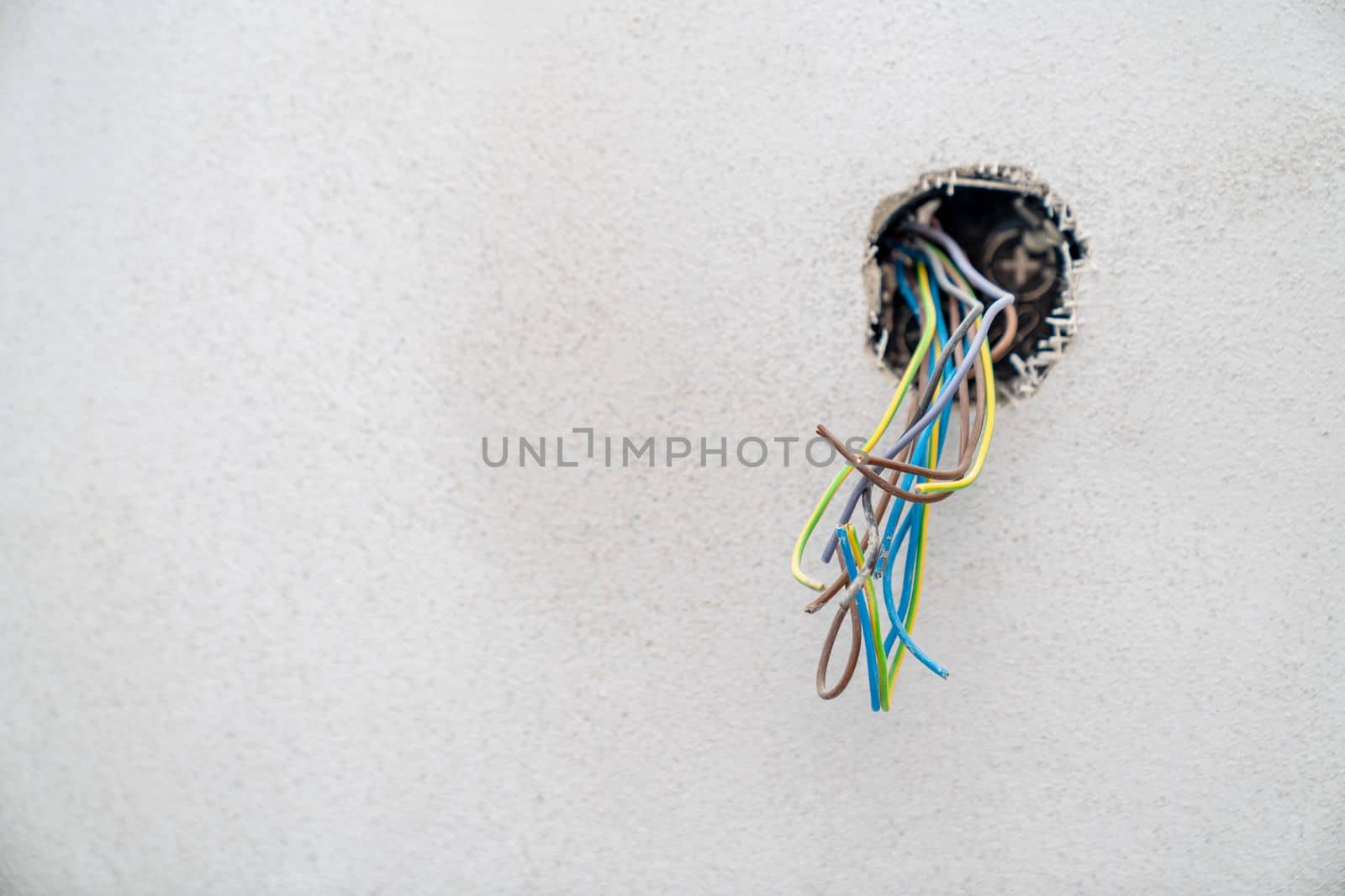 colored wires in the wall, preparation of electrical installation for a new house by Edophoto