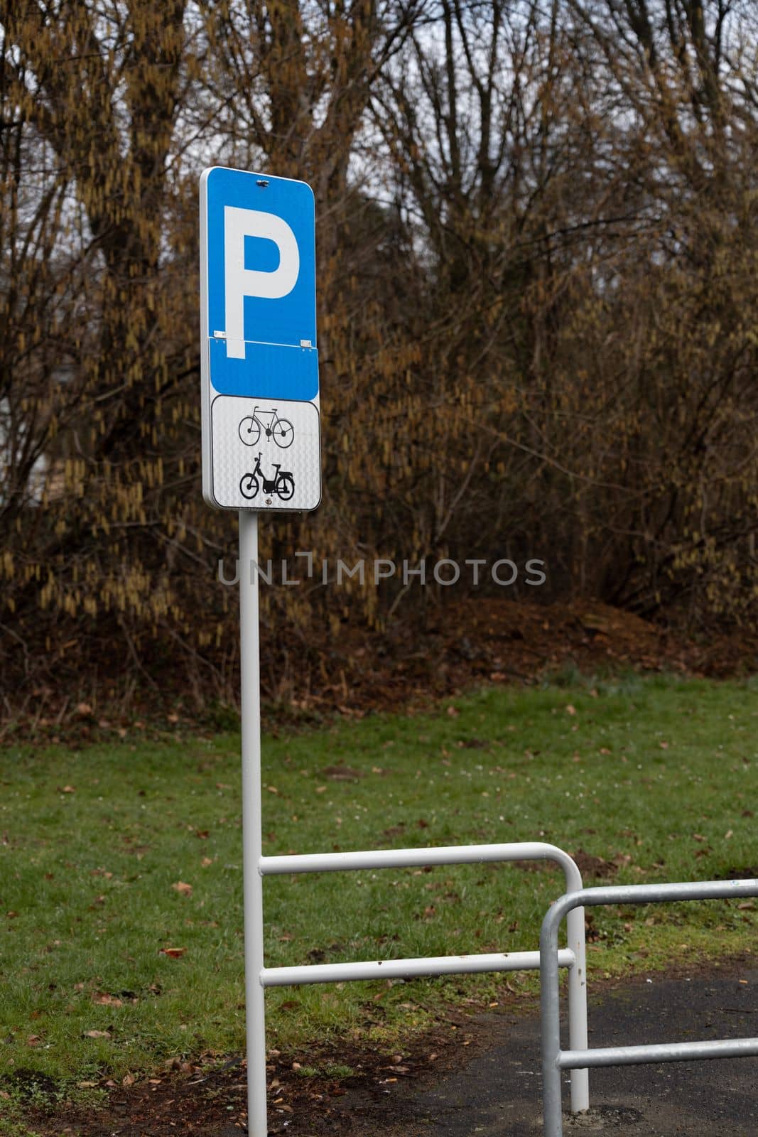 Parking area for bicycles and motorcycles in the street. Parking sign for bicycles and motorcycles