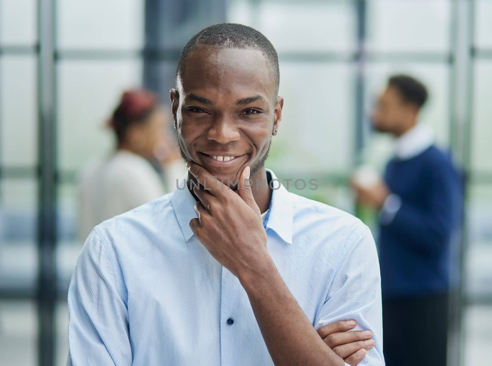 Portrait of a young African American businessman at his workplace waiting for inspiration while