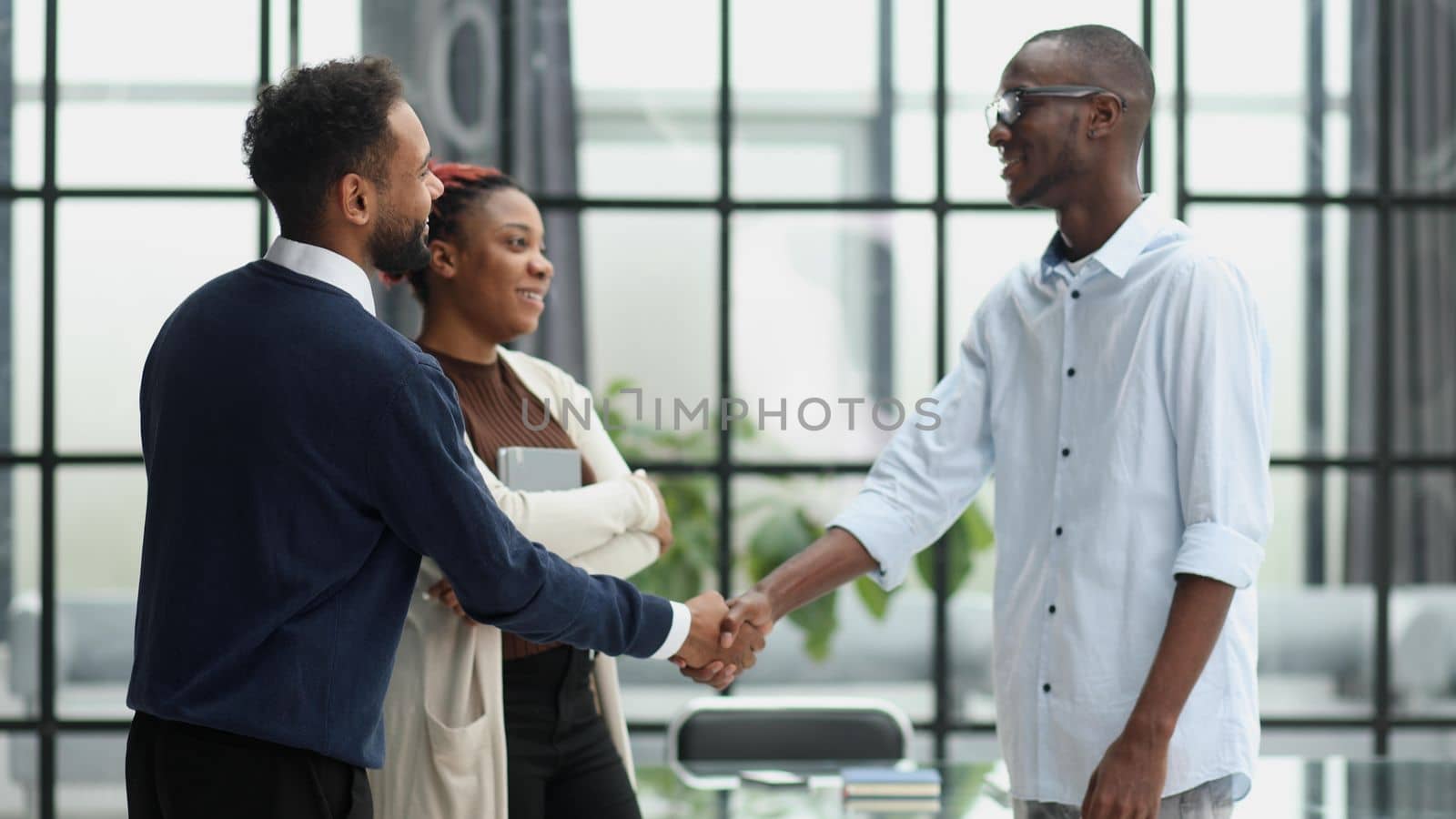 three african business people standing in the office