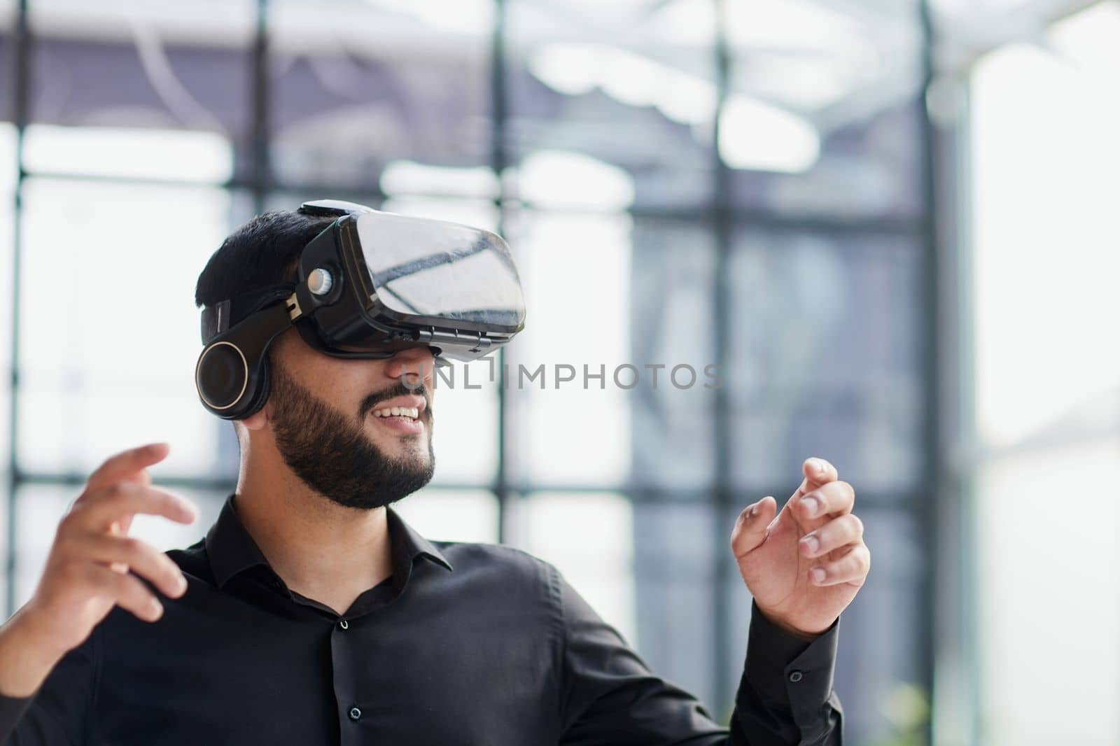 Businessman with virtual reality headset at office