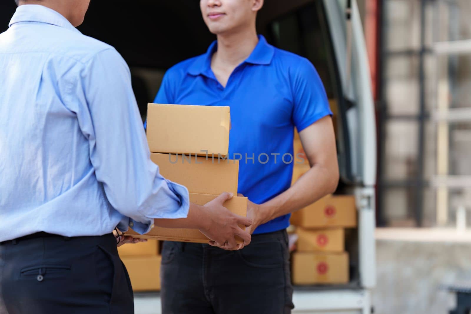 Asian Man hand accepting a delivery boxes. delivery logistic concept by itchaznong