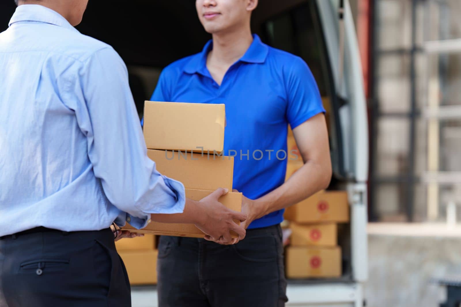 Asian Man hand accepting a delivery boxes. delivery logistic concept.