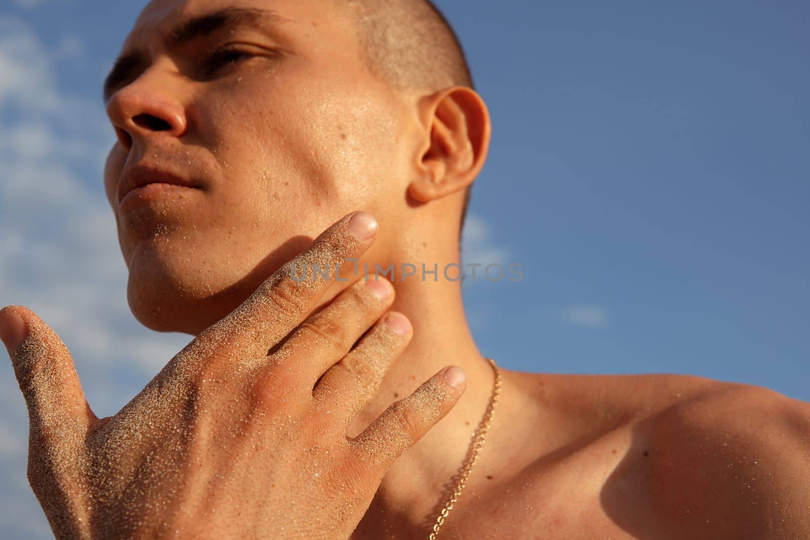 a man checks his pulse after training by Alexzhilkin