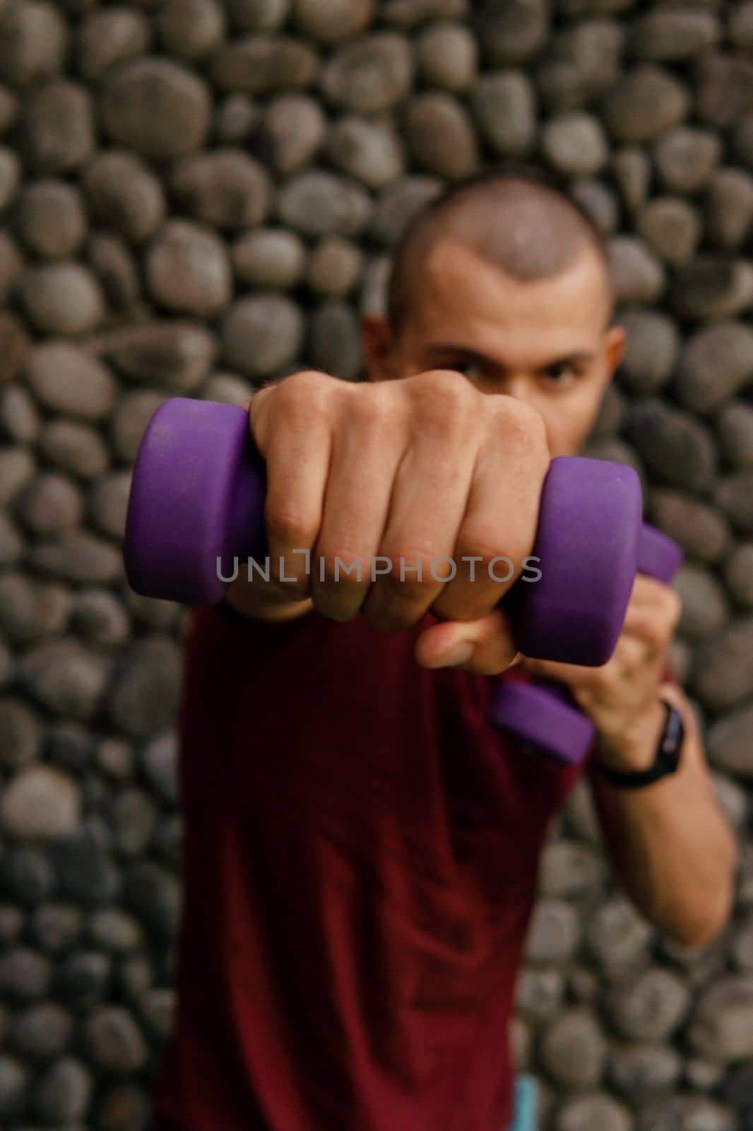 man boxing with dumbbells by Alexzhilkin