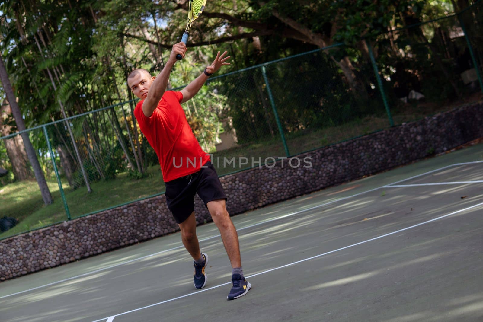 man playing tennis by Alexzhilkin