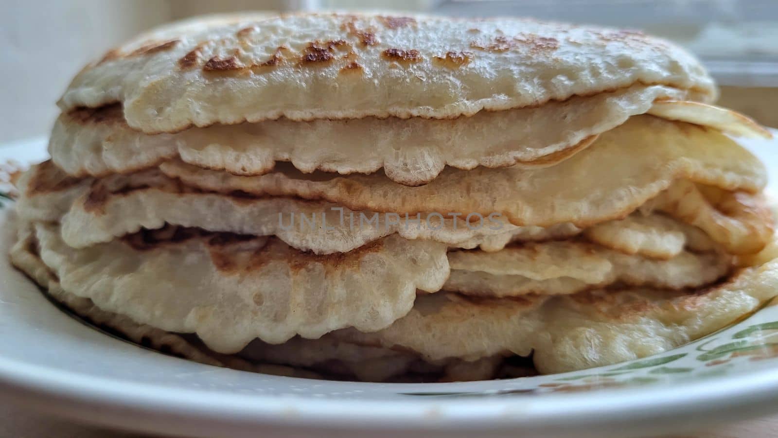 A bunch of pancakes on a plate. Maslenitsa celebration.
