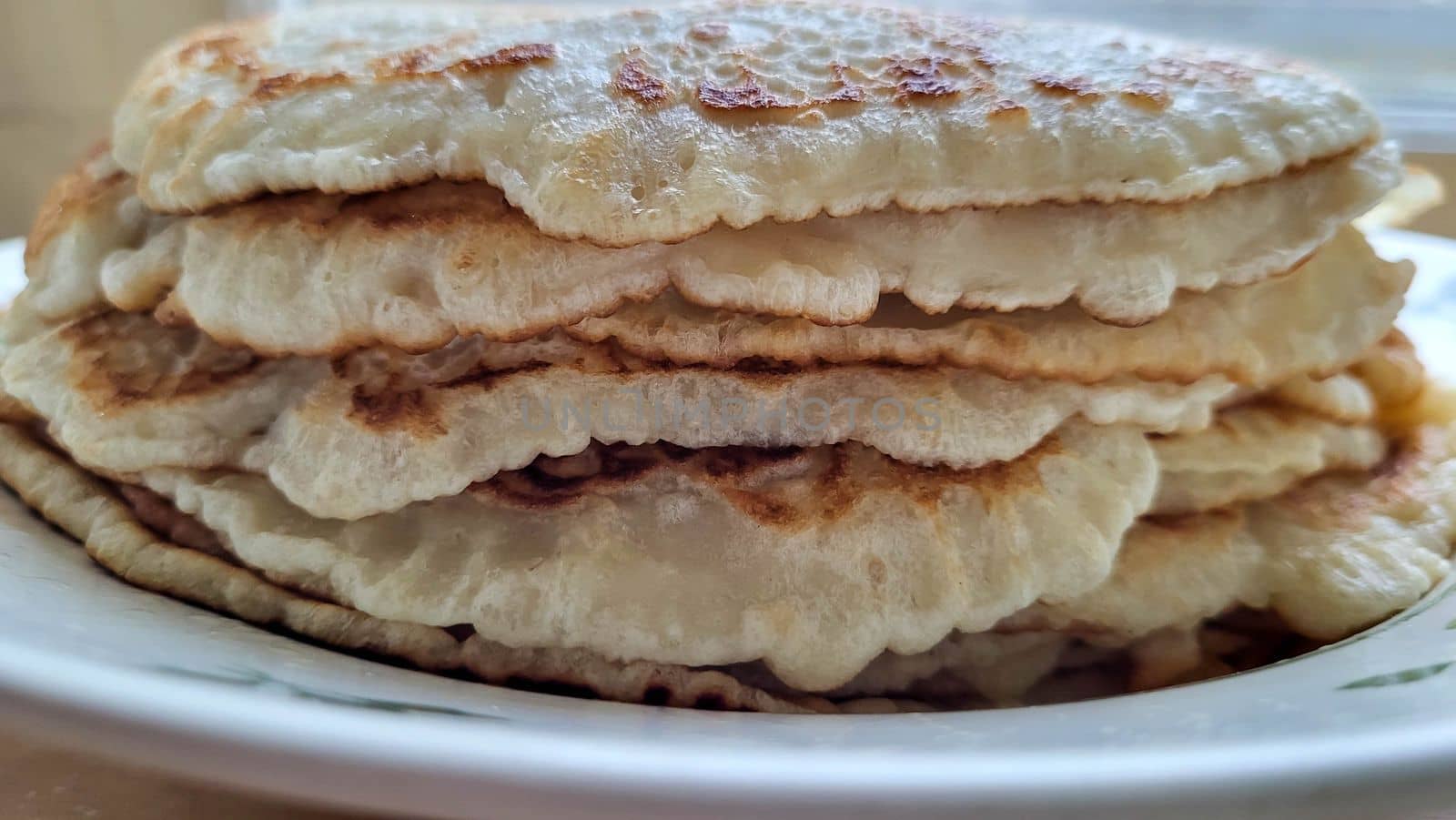 A bunch of pancakes on a plate. Maslenitsa celebration by lapushka62