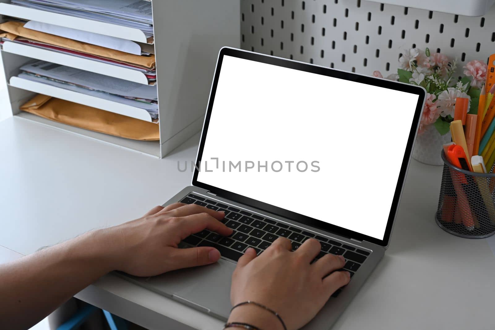 Close up view businessman hands typing on computer laptop. by prathanchorruangsak