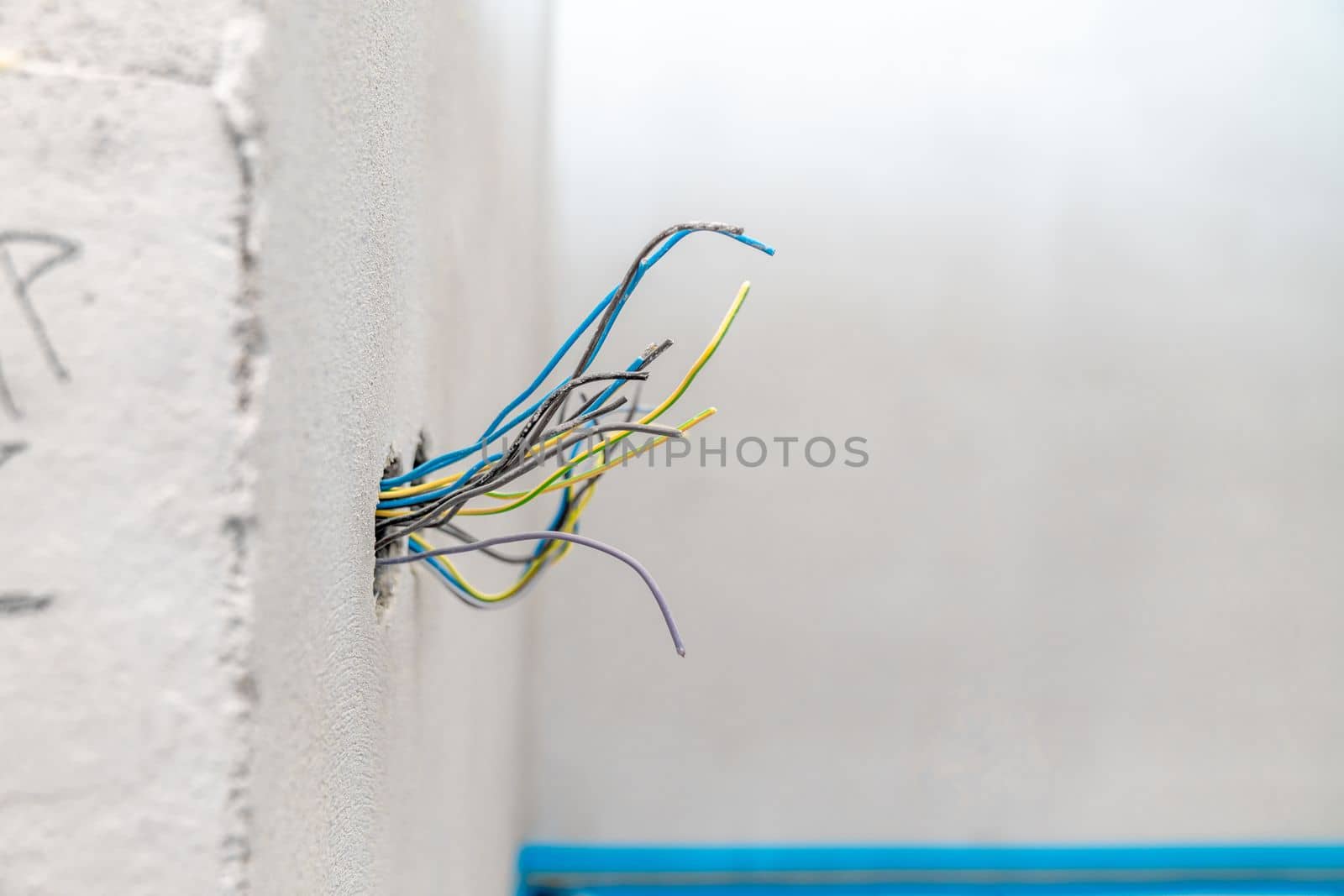 colored wires in the wall, preparation of electrical installation for a new house by Edophoto