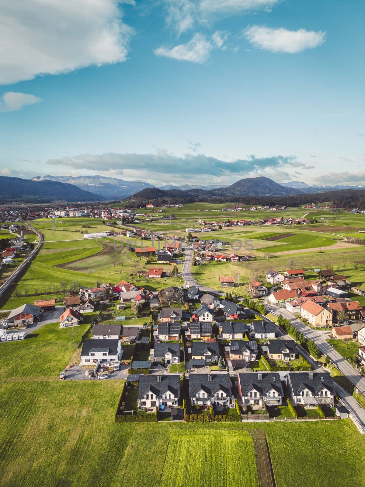 Aerial view of smaller residential area with new build houses in the countryside of Slovenia by VisualProductions