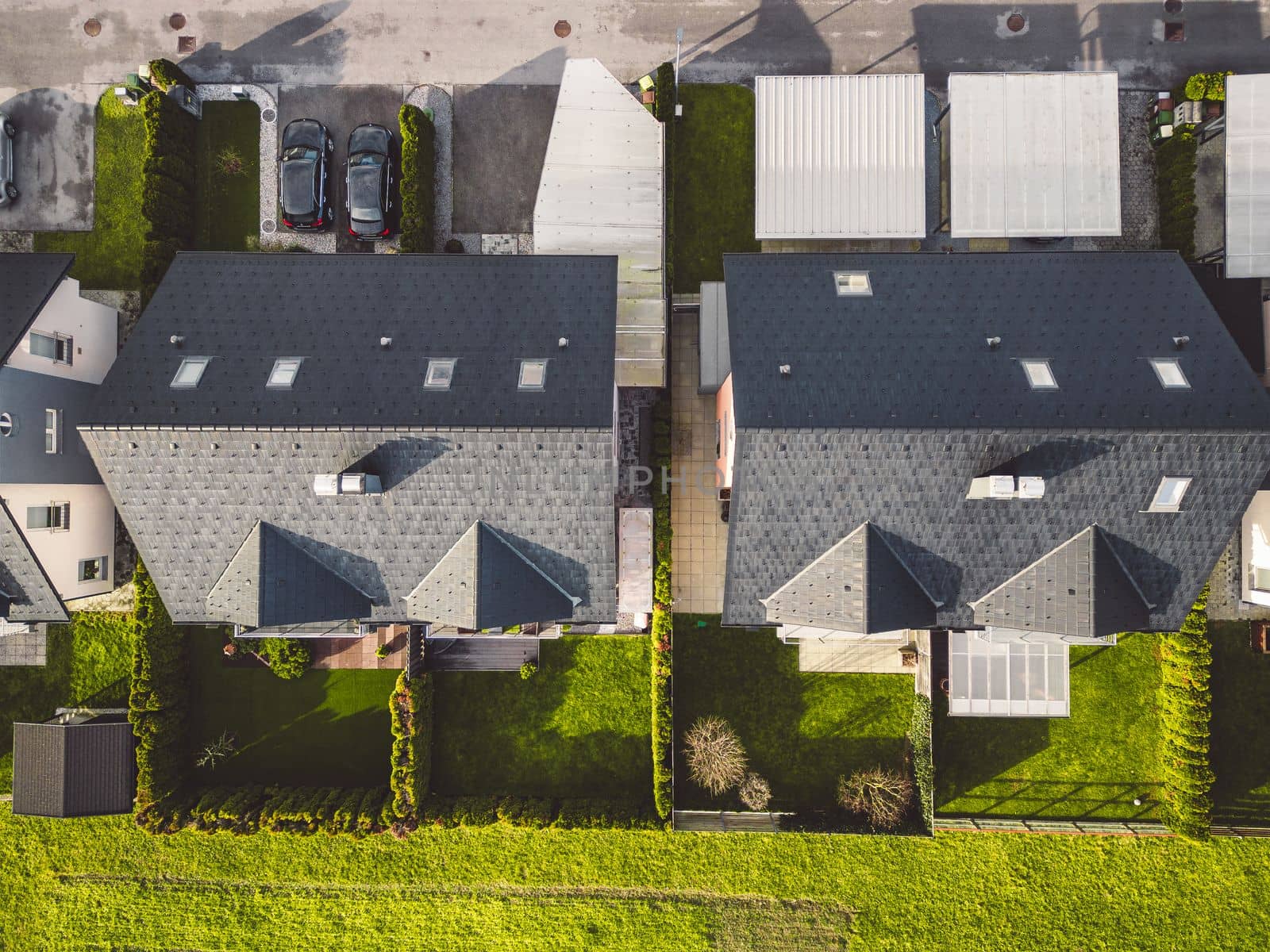 Drone view, aerial shoot of new build houses in the suburbs of Slovenia, somewhere in the country side, Europe. New modern houses, family homes.