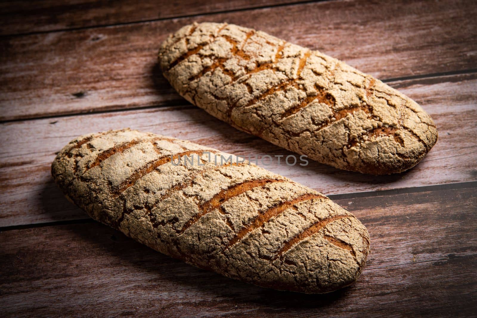 Rye bread on brown background. High quality photo