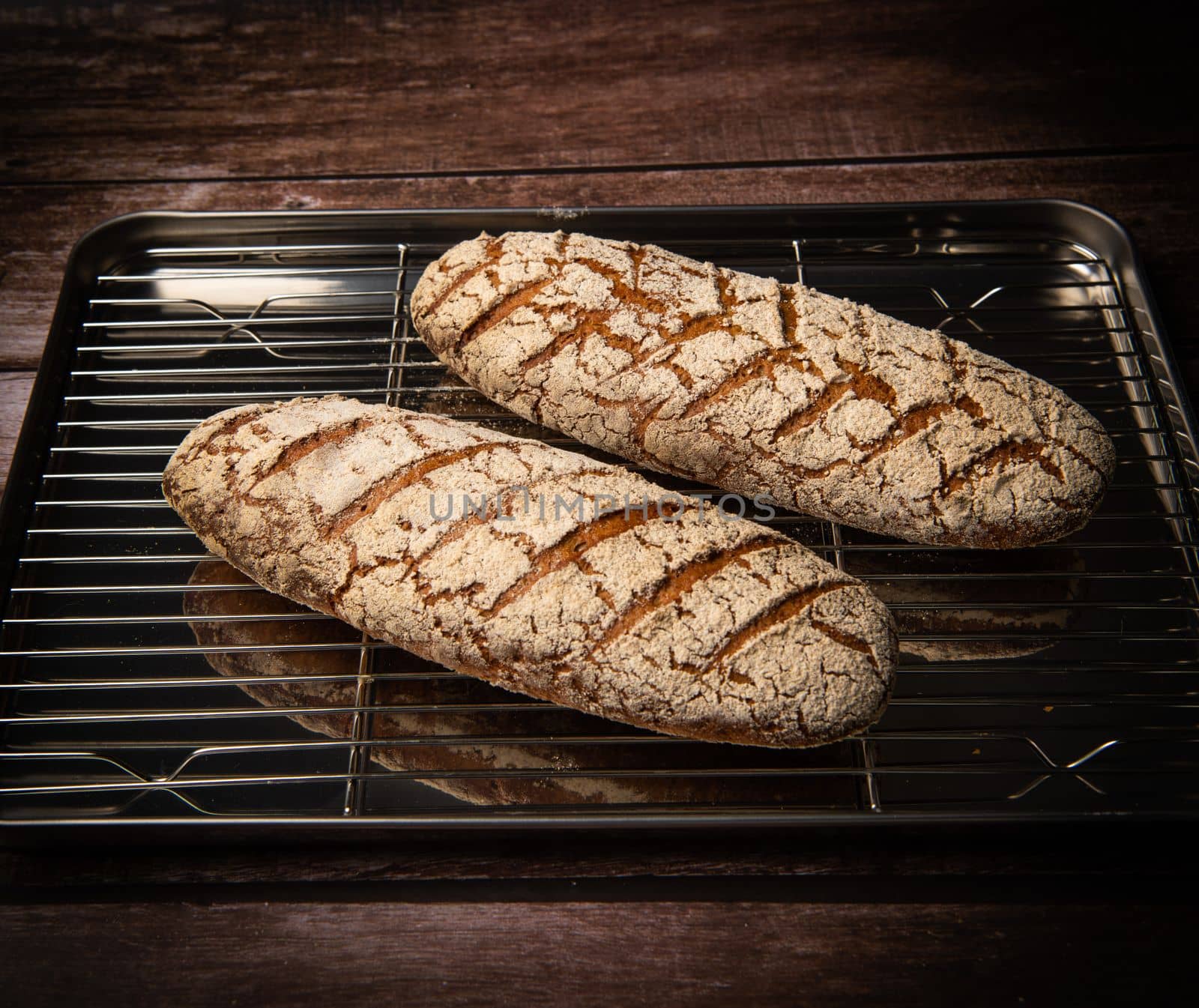 Rye bread on brown background. High quality photo
