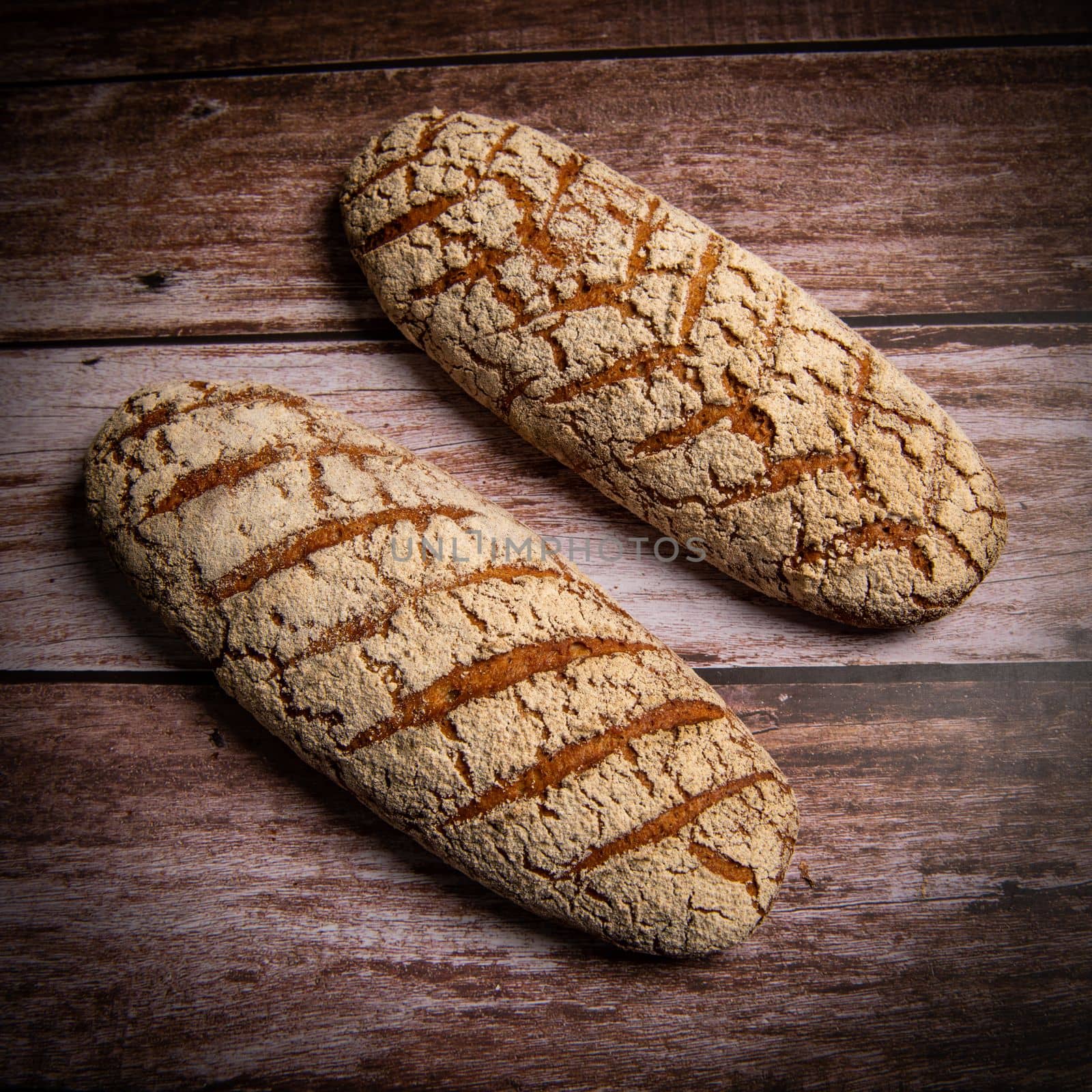 Rye bread on brown background. High quality photo