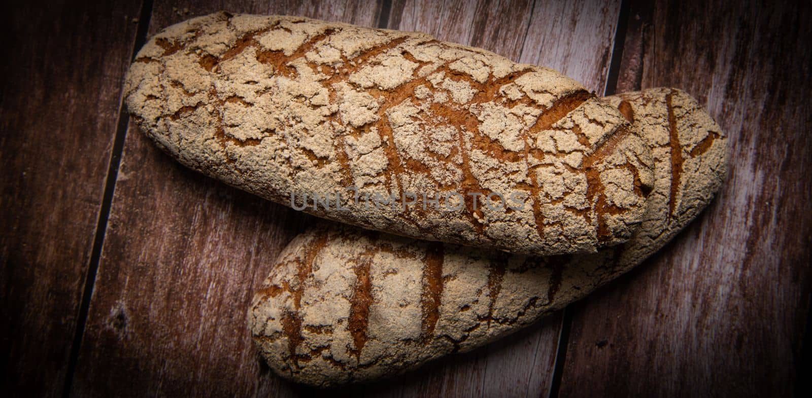 Rye bread on brown background. High quality photo