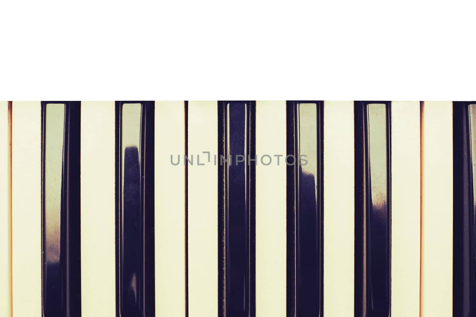 a set of keys on a piano or similar musical instrument. White and black musical keys of piano synthesizer with space for text. High quality photo