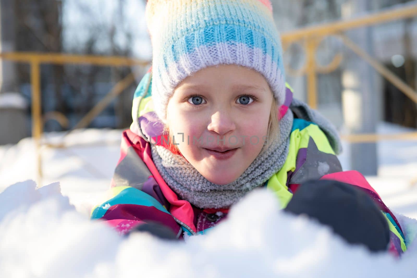 Adorable girl playing on snow by gcm