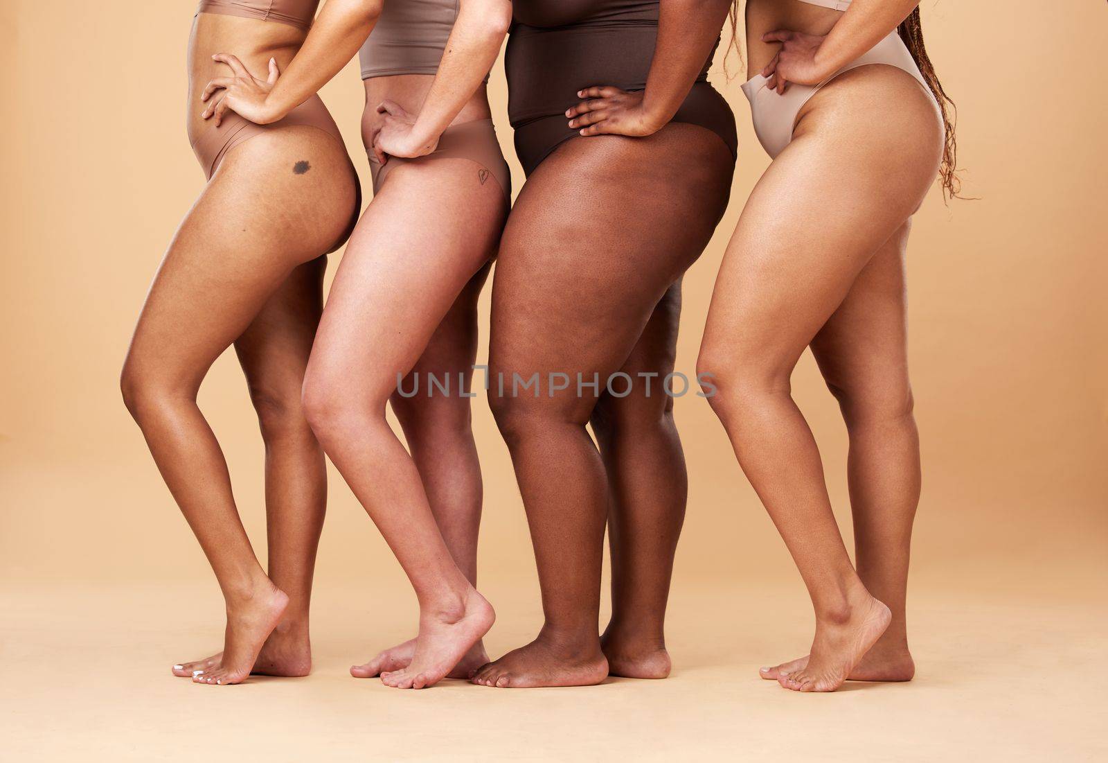 Diversity women, legs and different body and skin of group together for inclusion, beauty and power. Underwear model people on beige background with cellulite, pride and motivation for self love.