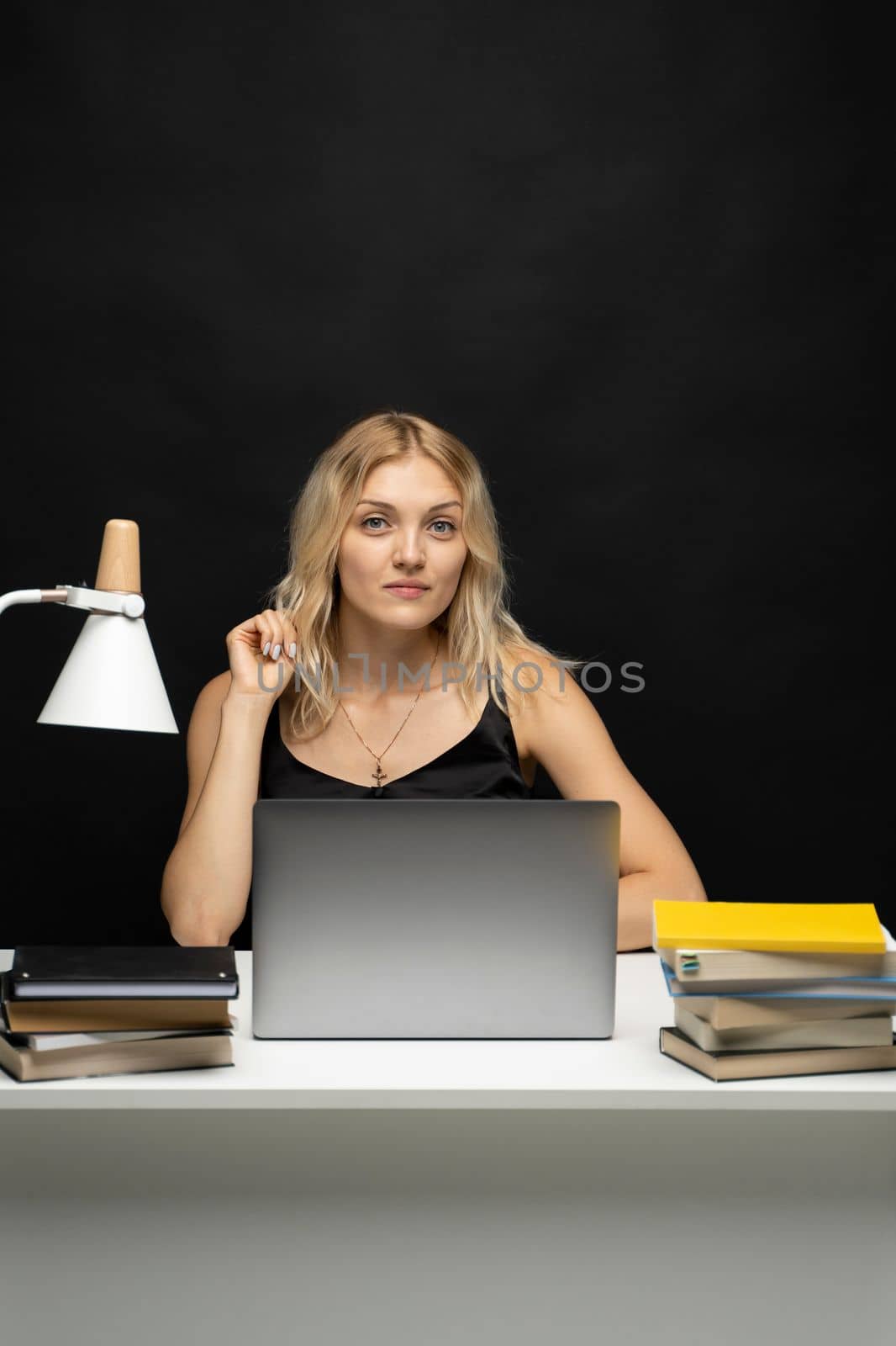 Young smiling freelancer woman using laptop for remote work, e-learning at university college, e-banking, online shopping, webinars. by vovsht