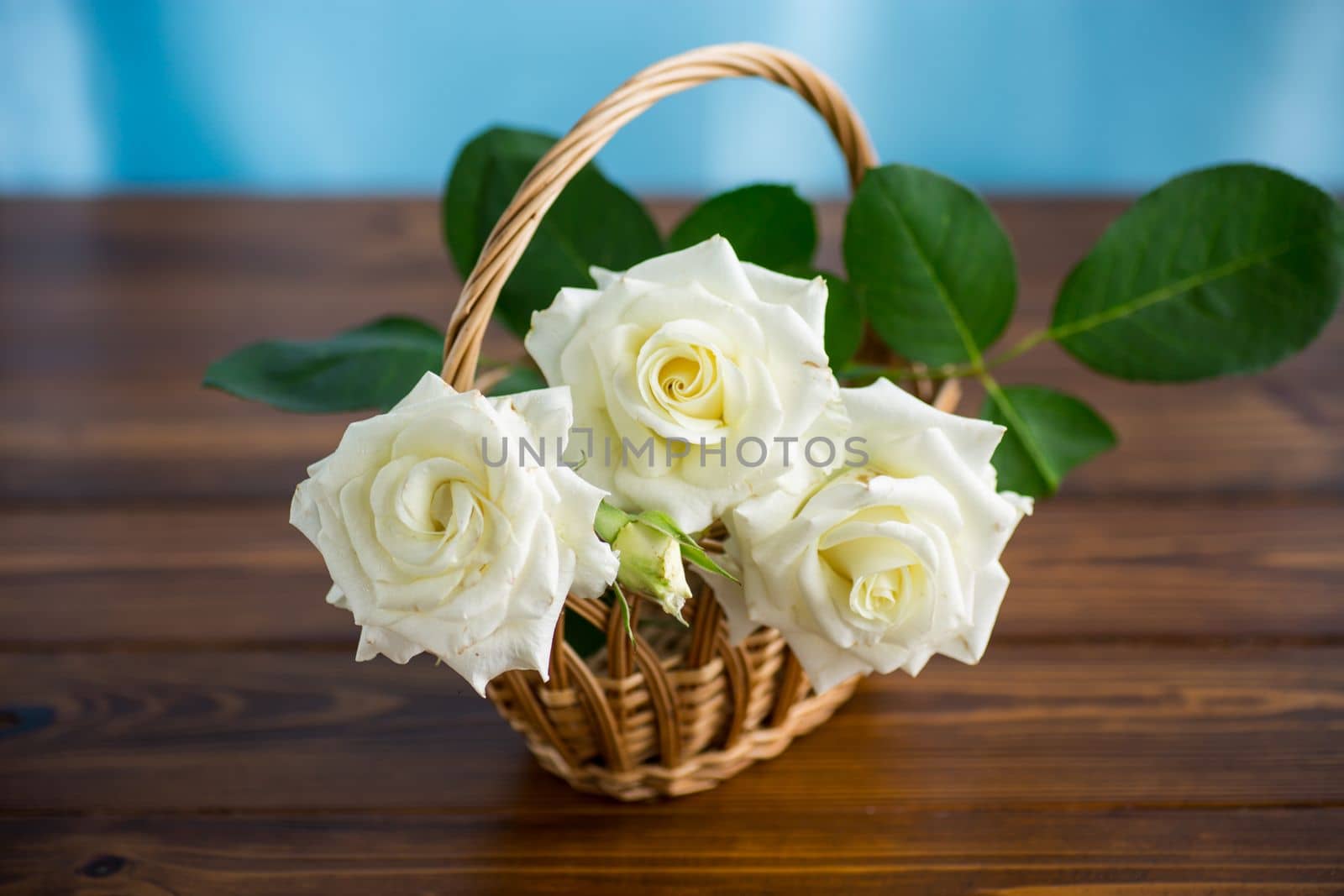 bouquet of beautiful white roses on a wooden table