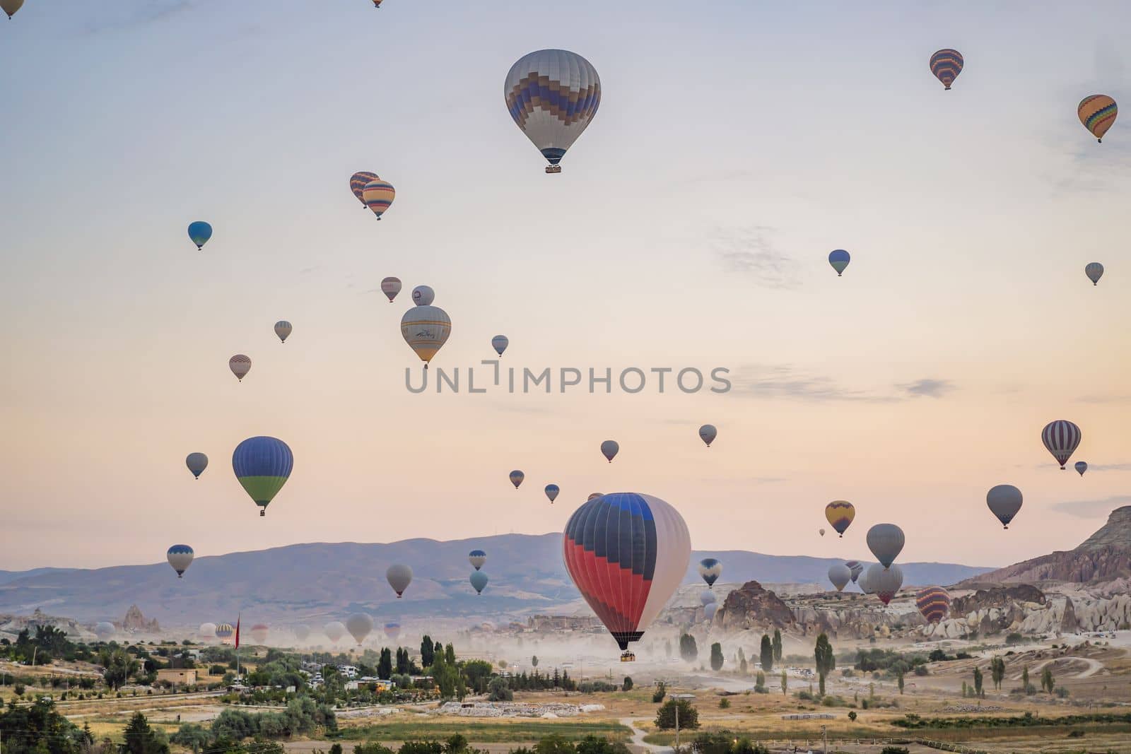 Colorful hot air balloon flying over Cappadocia, Turkey by galitskaya