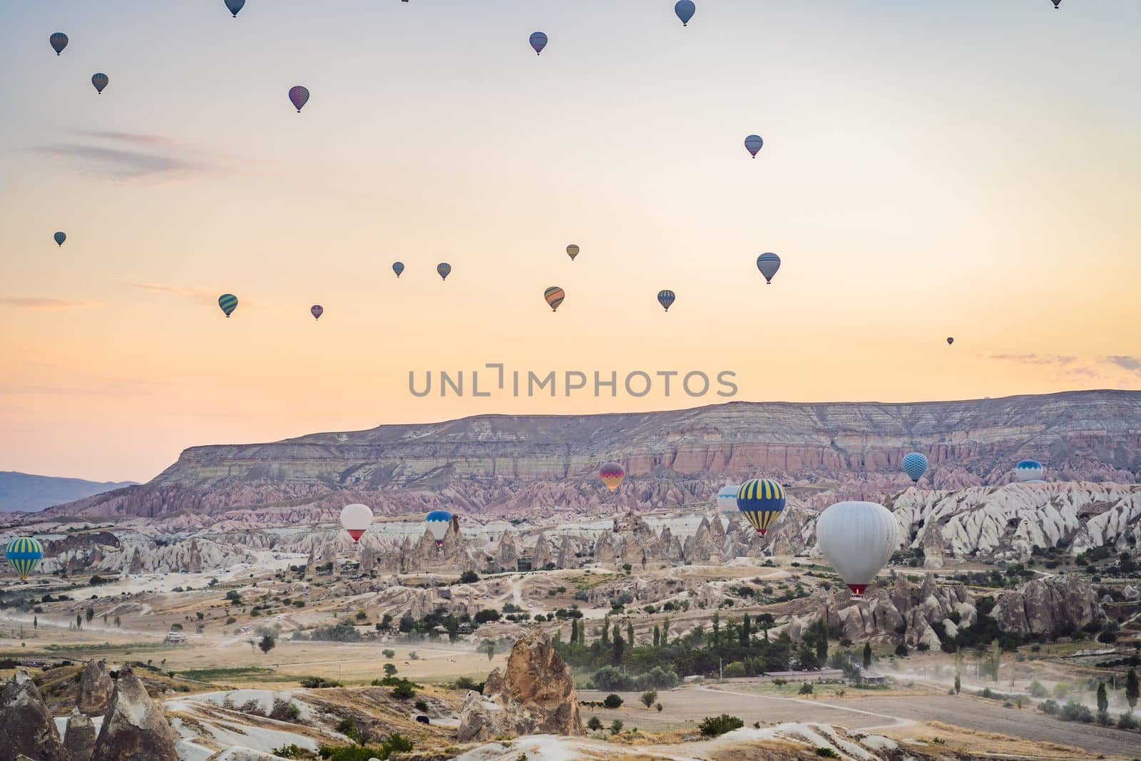 Colorful hot air balloon flying over Cappadocia, Turkey by galitskaya