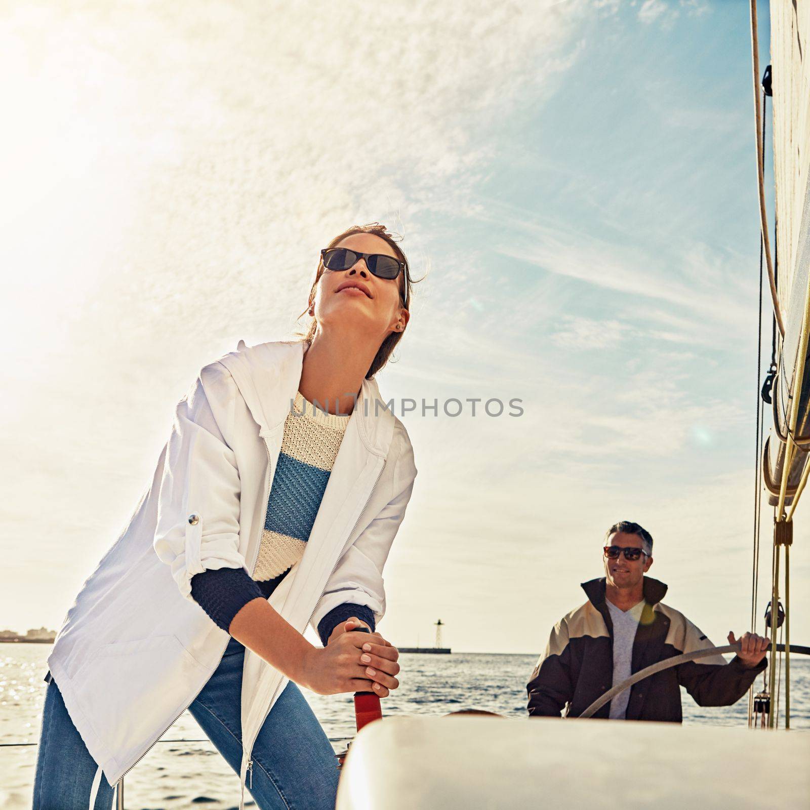 Set sail. Sailing, couple and steering helm in sea travel, summer vacation and holiday adventure hobby. Yacht, cruise ship or boat direction of people on ocean or lake water with outdoor lens flare