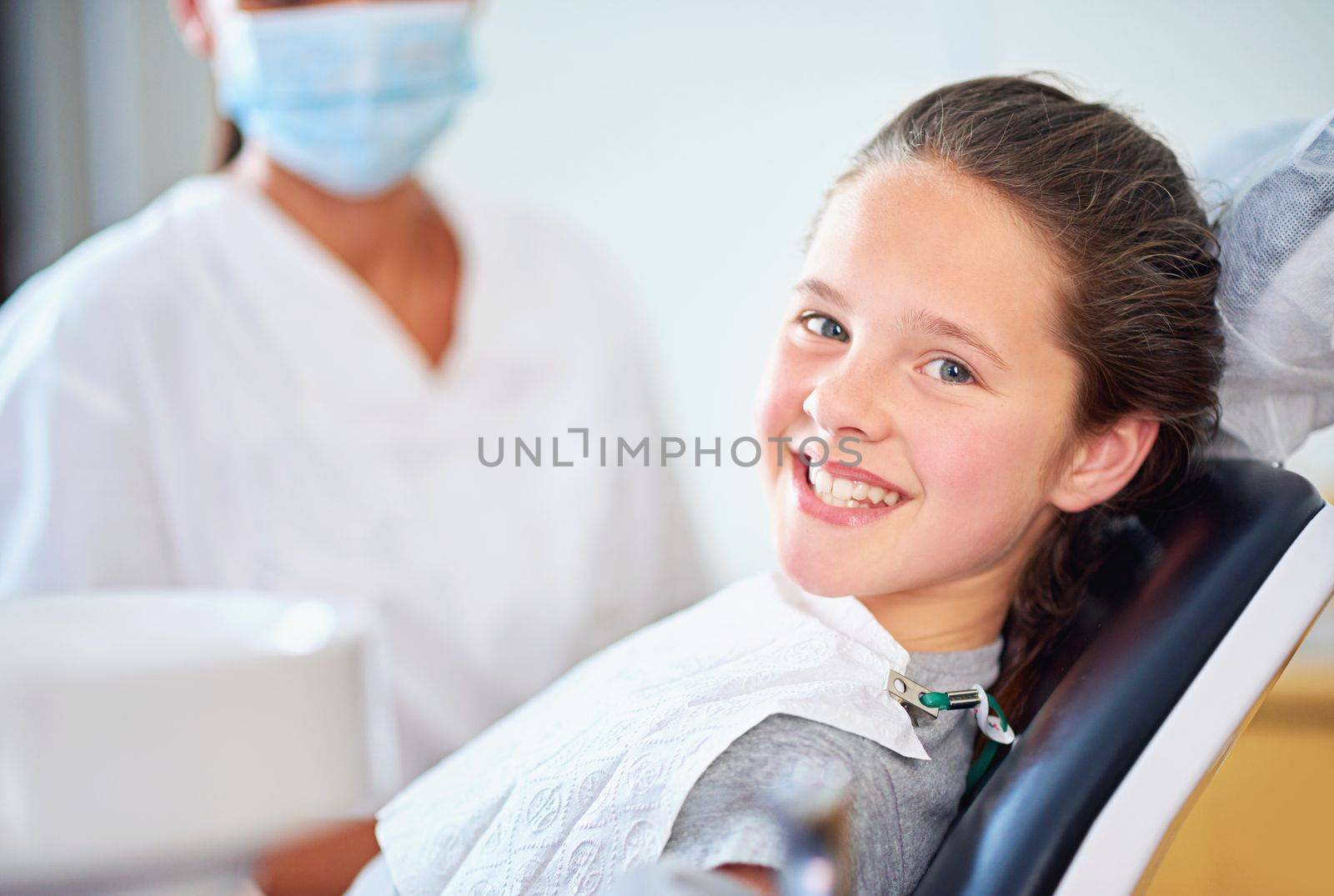 Cavity free smile. a female dentist and child in a dentist office. by YuriArcurs