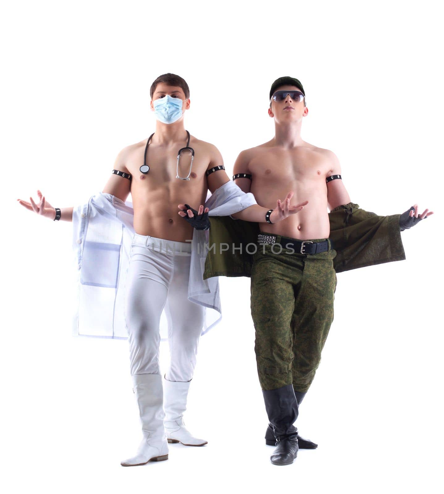 Full length portrait of two muscular strippers performing dance. Isolated on white