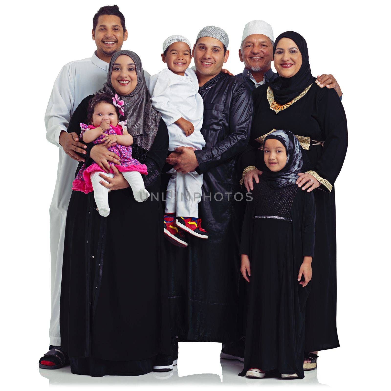 the perfect family portrait. Studio portrait of a multi generational muslim family isolated on white. by YuriArcurs