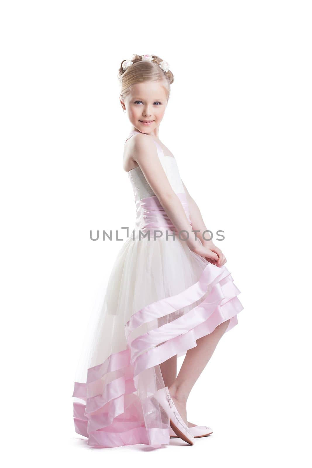 Full length portrait of pretty little girl in beautiful dress. Isolated on white