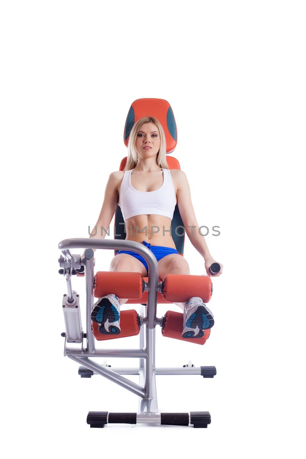 Blonde woman sitting on orange hydraulic exerciser. Isolated on white
