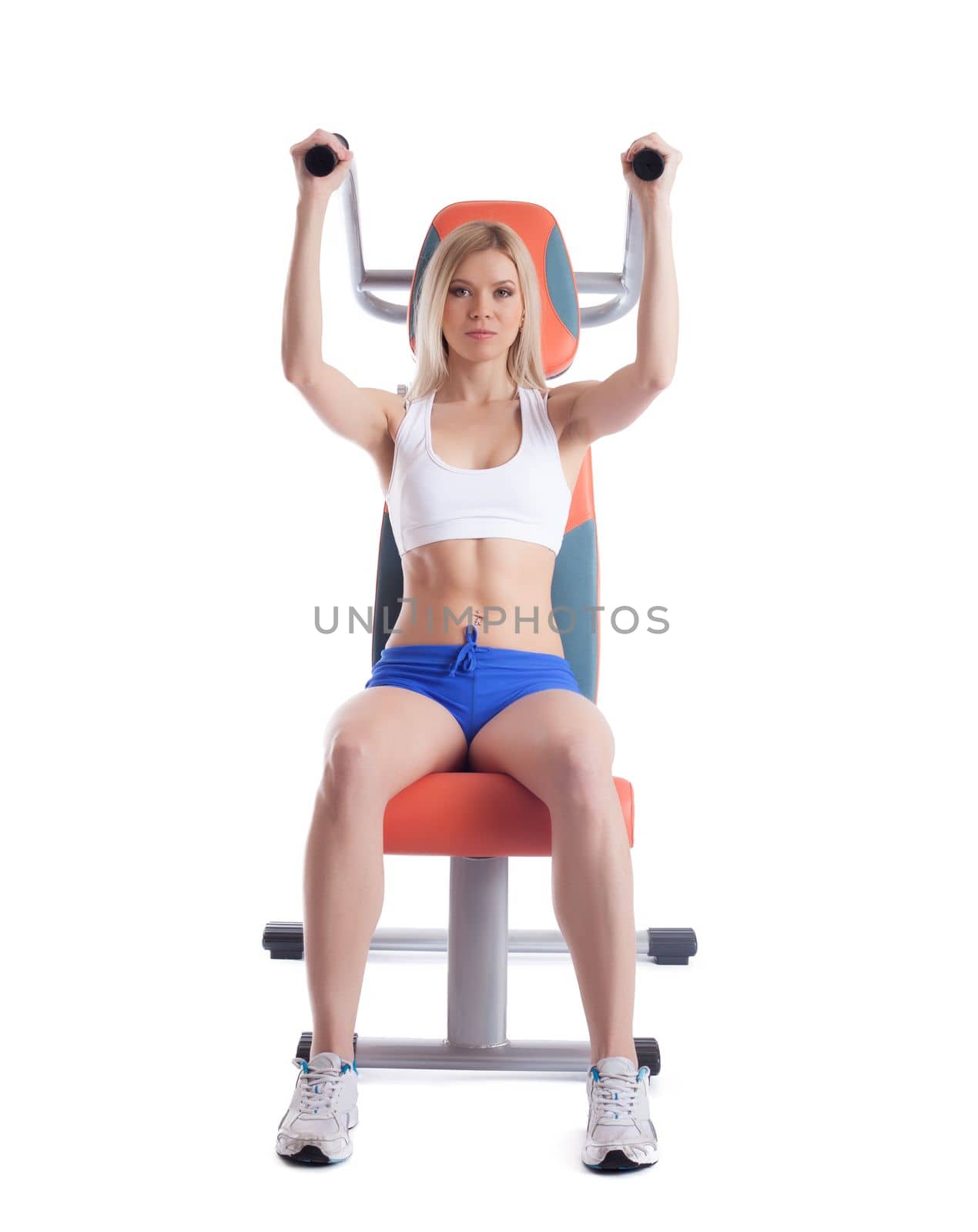 Beautiful blonde on power exerciser isolated on white