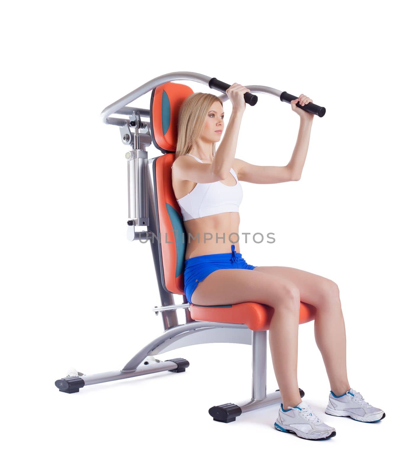 Full length portrait of athletic young woman on isodynamic exerciser. Isolated on white