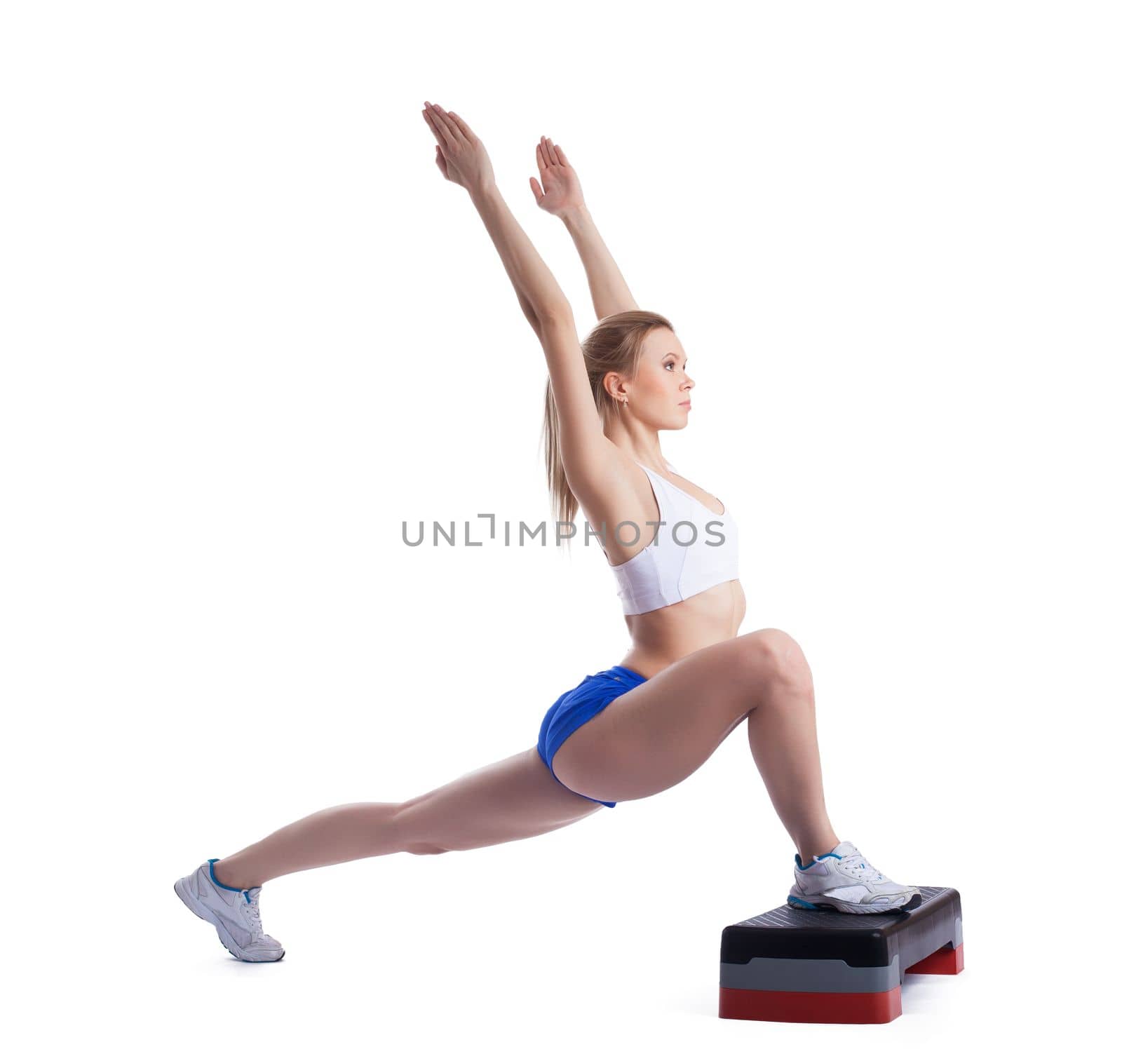 Young blonde woman with stepper. Isolated on white