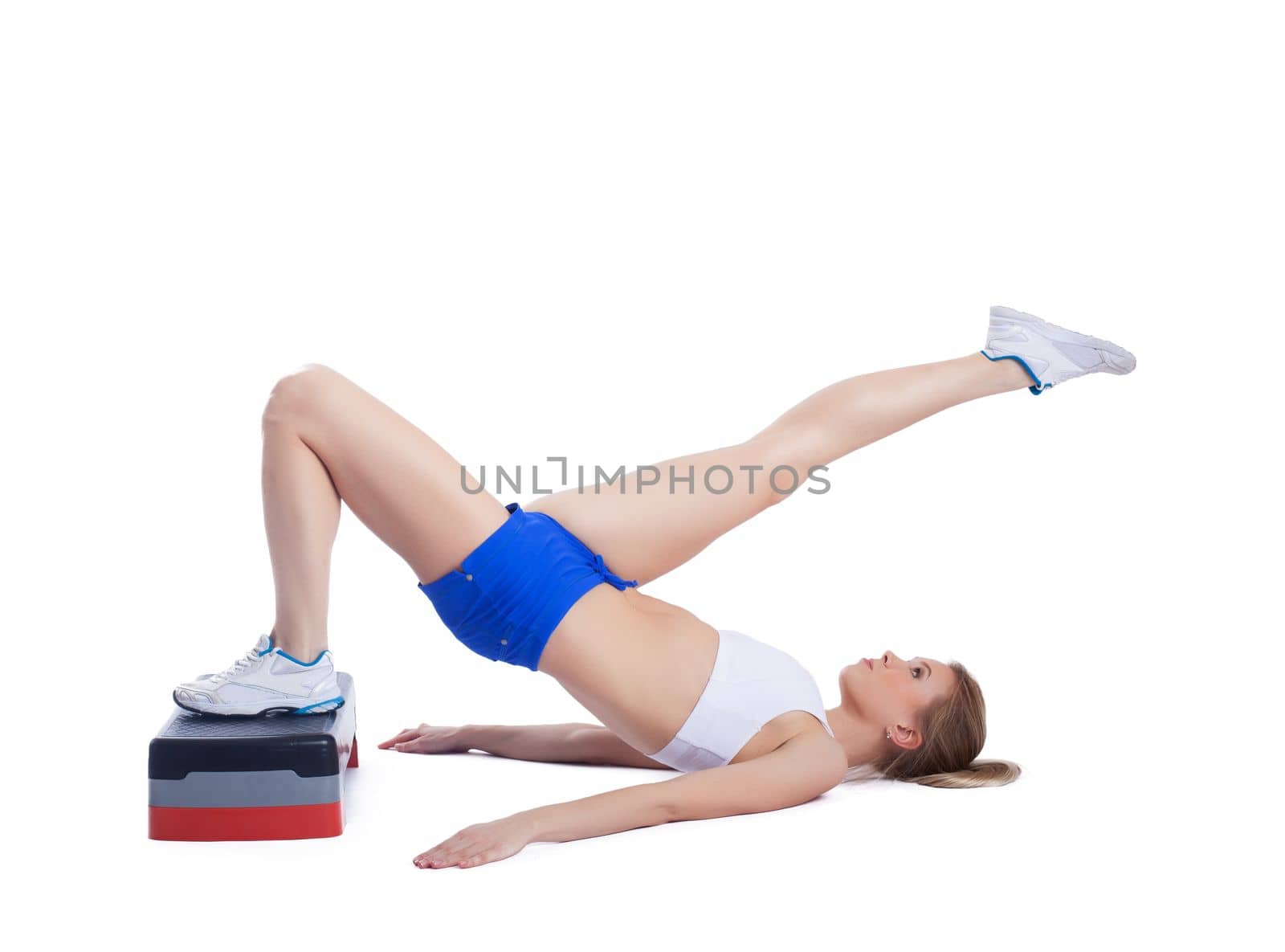 Fitness blonde woman with stepper. Isolated on white
