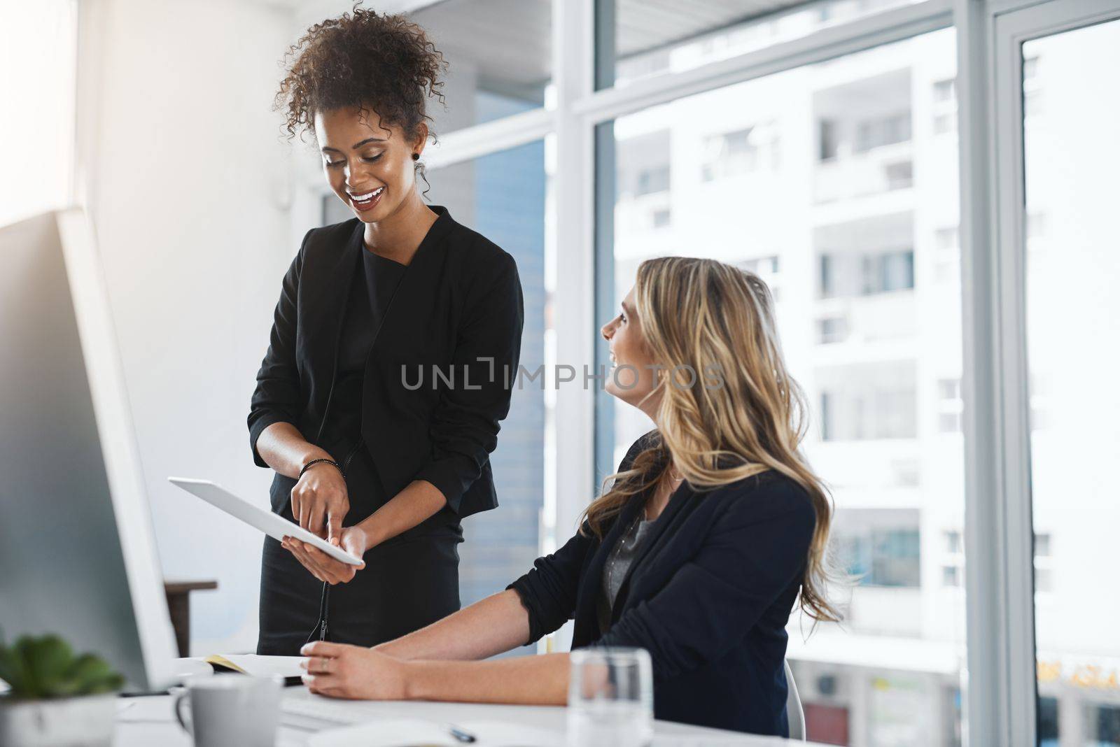 Technology can only improve their plans. two businesswomen working together in an office
