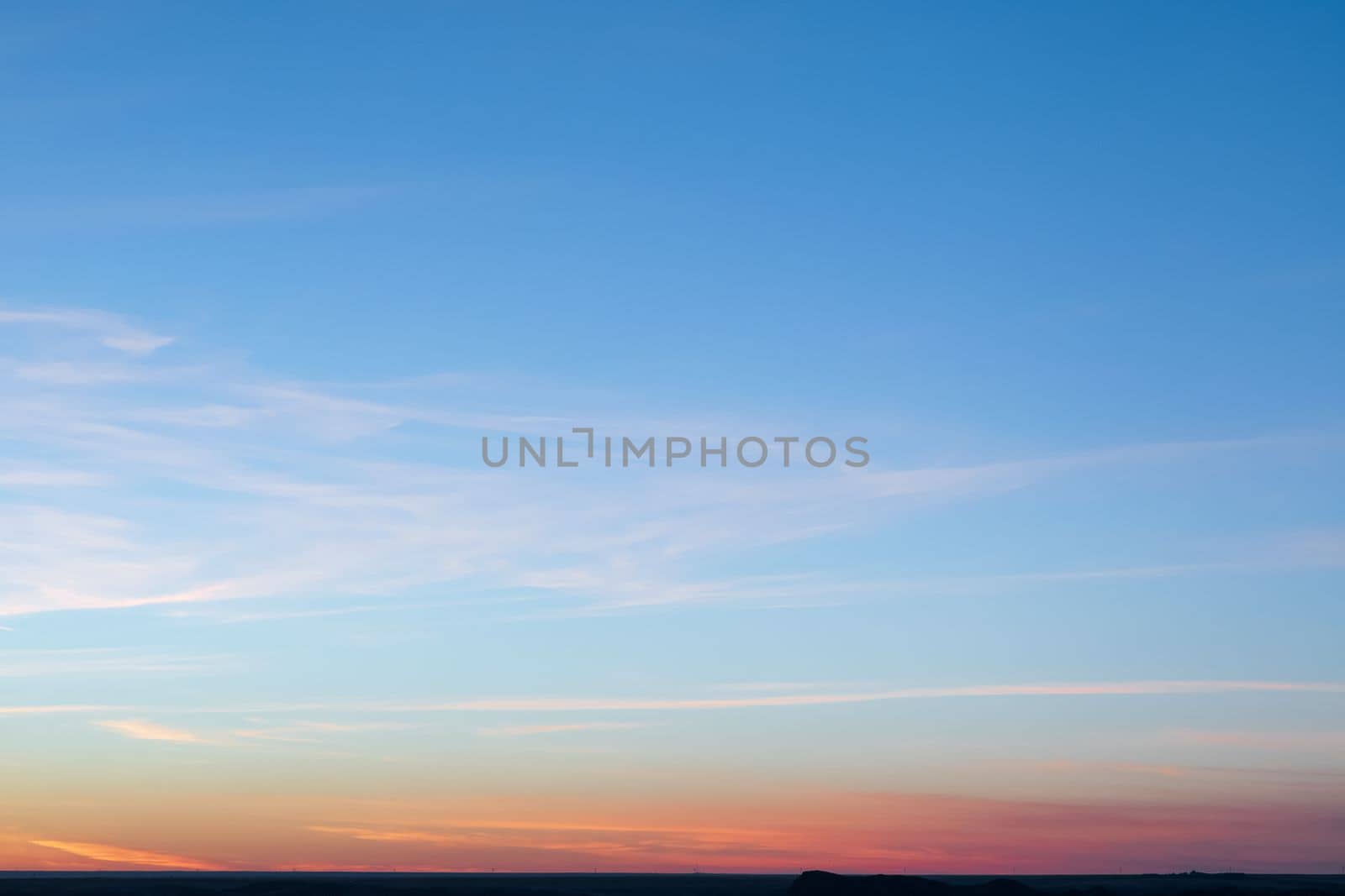 Minimal artistic colorful sunset sky background with horizon line.