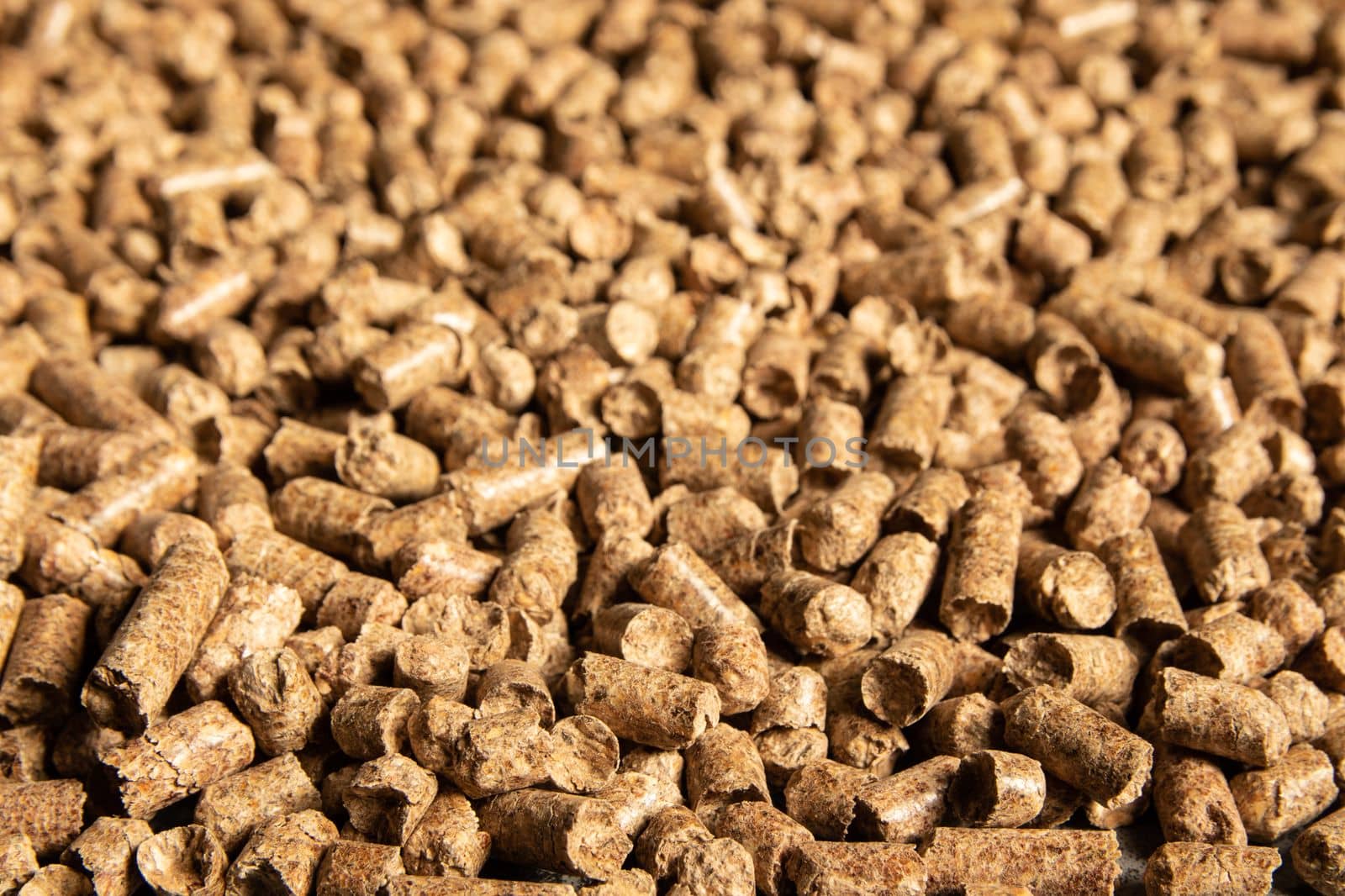 Toilets for pets, wood filler in the form of small compressed pellets background.